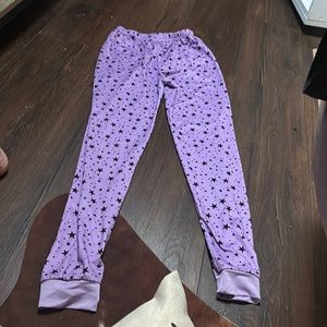 Purple pajama pants with black stars